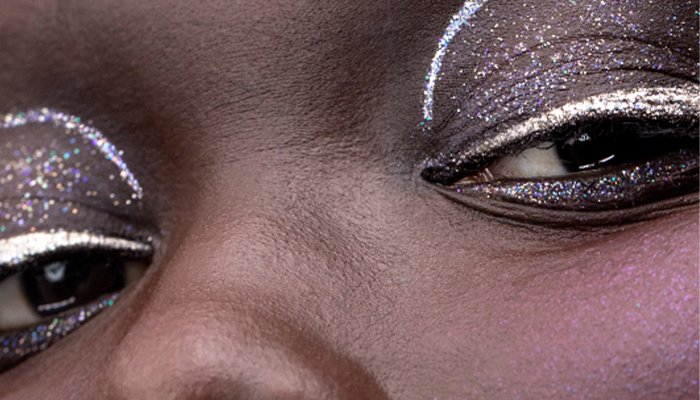 Model wearing a metallic graphic eyeliner look 